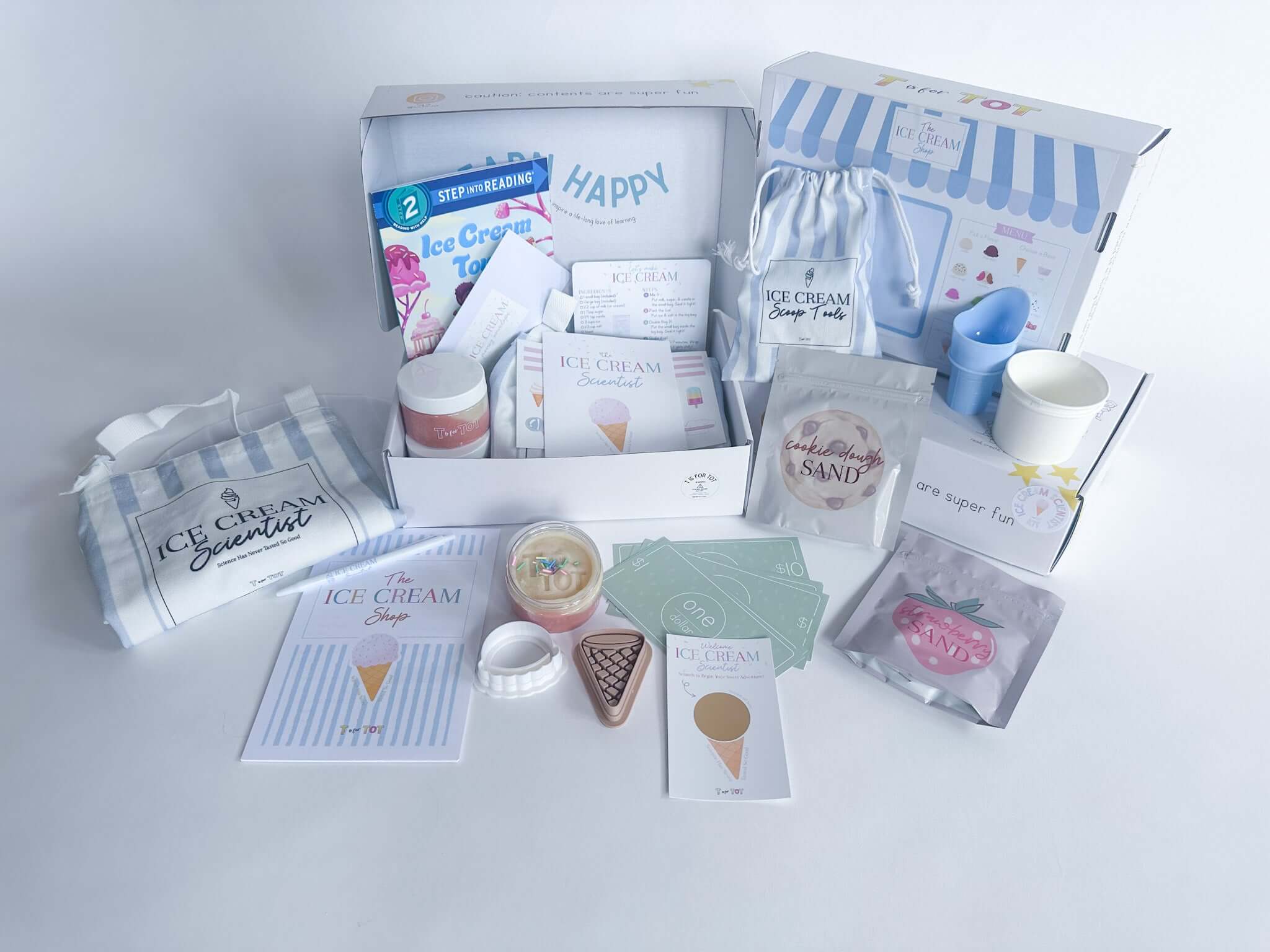 Colorful Ice Cream Scientist Kit featuring ice cream ingredients, recipe cards, and playful accessories for kids.